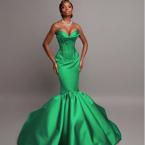 May be an image of gown, dress and text