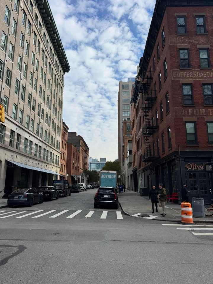 May be an image of fire escape, street, road, skyscraper, lamppost, buildings and text