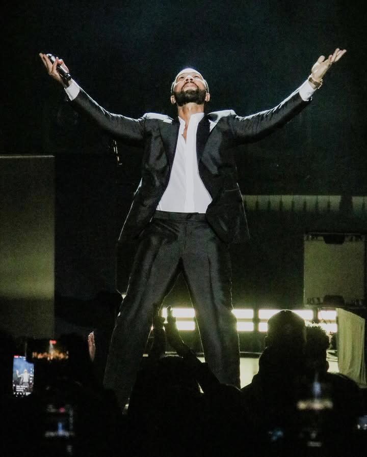 May be an image of microphone, concert and text