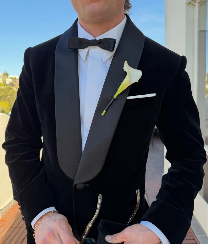 May be an image of suit, dinner jacket, bowtie and text