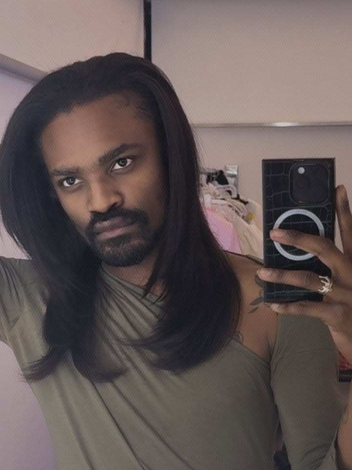 May be a selfie of one or more people, beard, hair, makeup, mirror and turtleneck