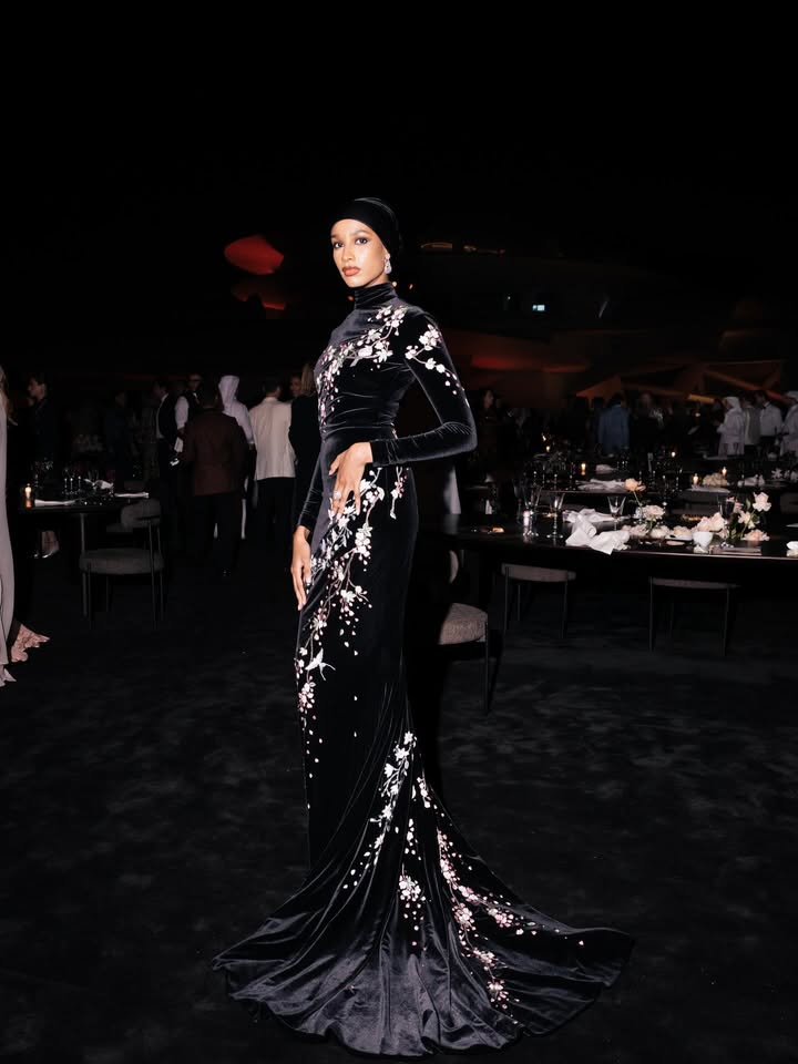 May be an image of gown, dress and text