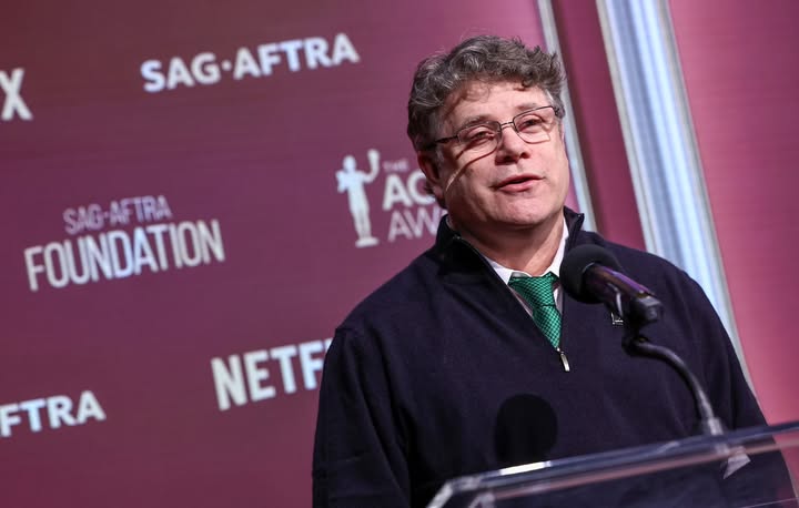 May be an image of microphone and text that says 'X SAG-AFTRA SAG SAG-AFTRA TRA FOUNDATION SAG YAS t AW AC FTRA NETF'