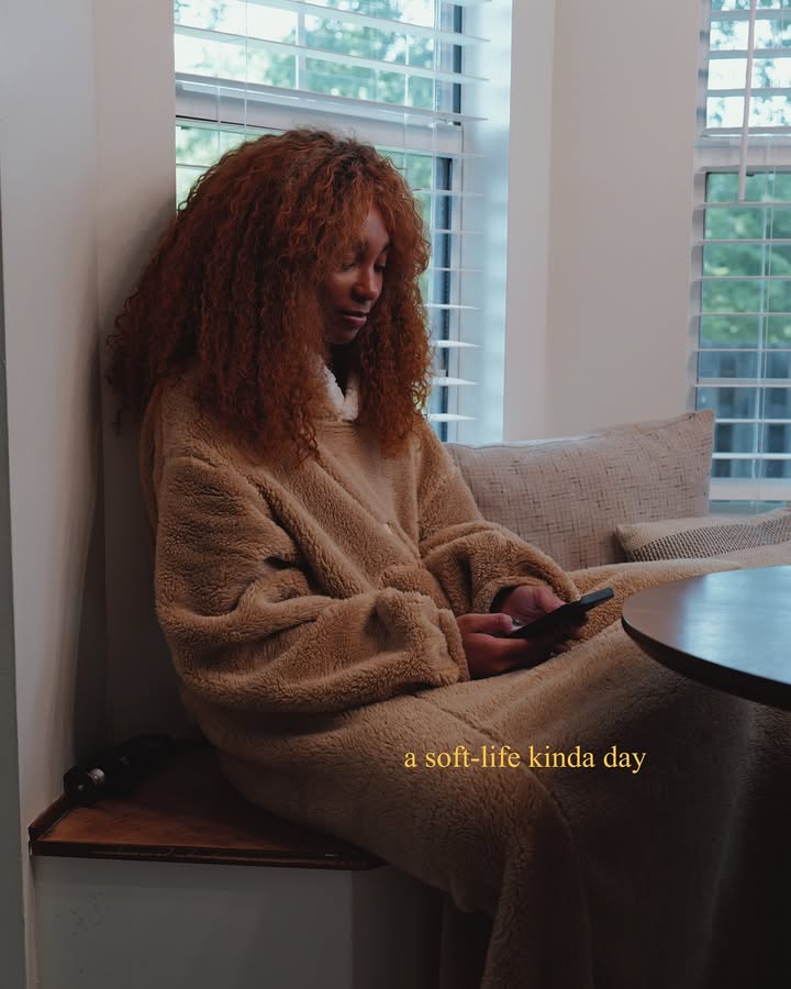 May be an image of one or more people, sleepwear, sweater, bath robe, cardigan and turtleneck