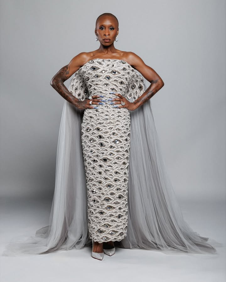 May be an image of one or more people, gown and dress