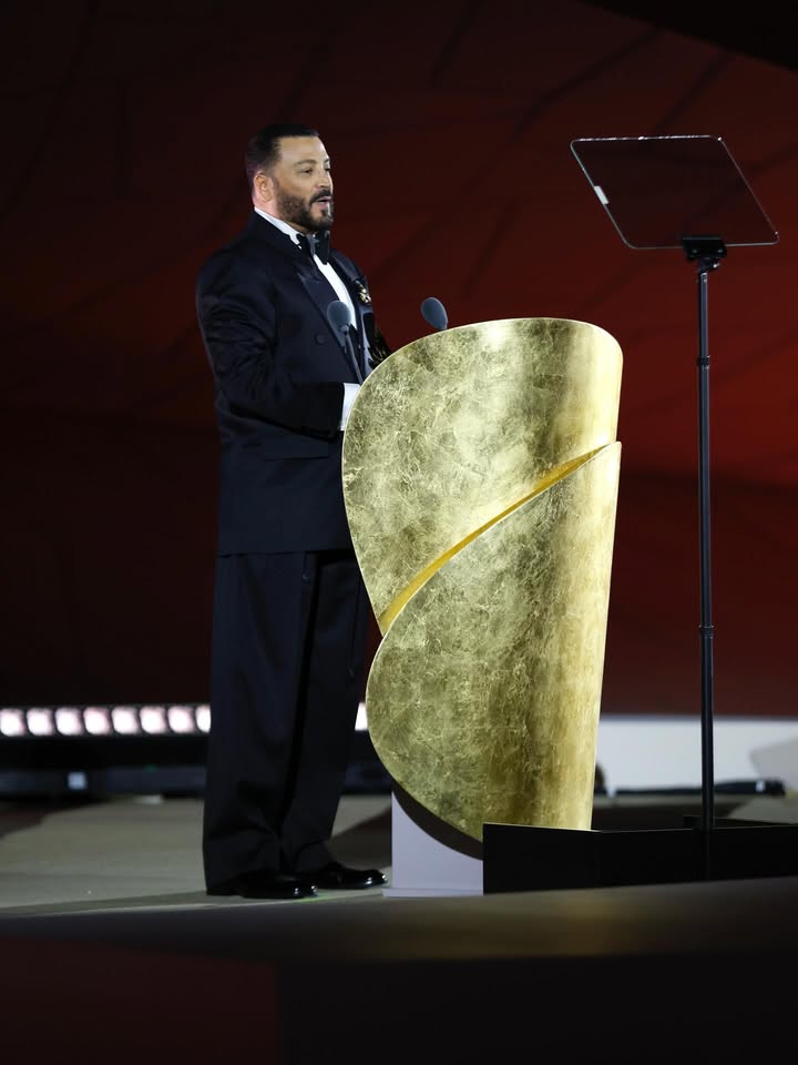 May be an image of microphone and text