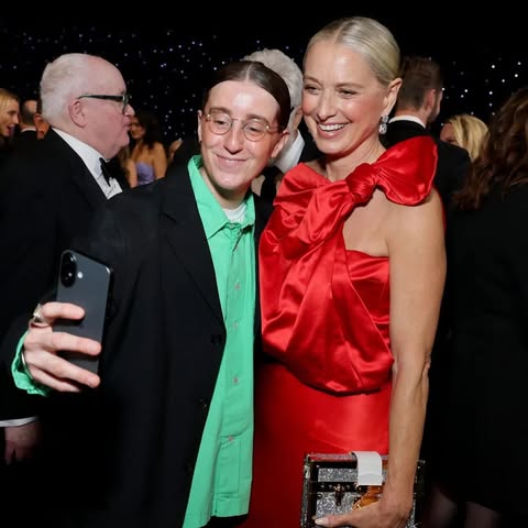 May be an image of one or more people, makeup, dinner jacket and text