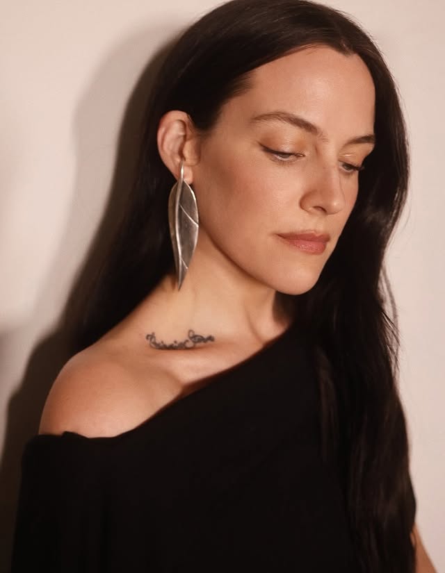 May be an image of one or more people, tattoo, jewelry and text