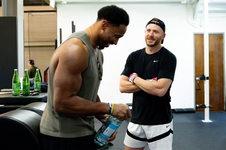Trevor Story and Cleveland Browns defensive end Myles Garrett chatting at Story's training facility in Southlake, Texas.