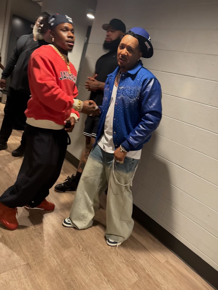 May be an image of one or more people, people standing, bandanna, jacket, sweatsuit and text