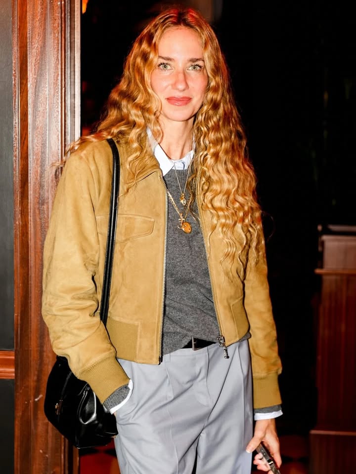 May be an image of outerwear, blazer and text