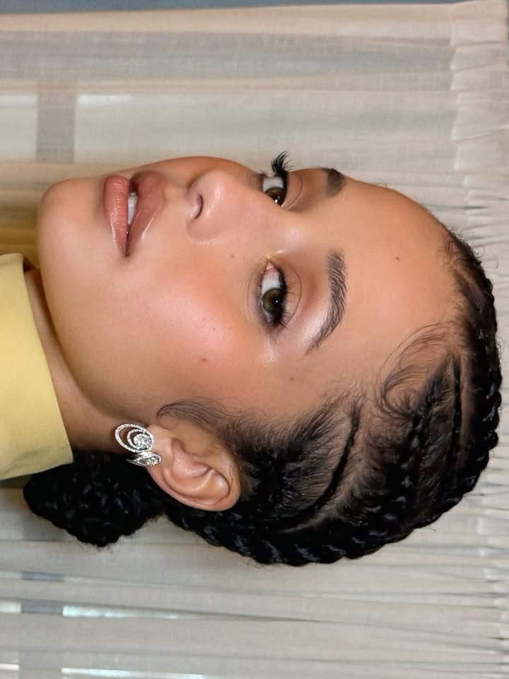 May be a closeup of one or more people, braids, eyeliner, makeup and text