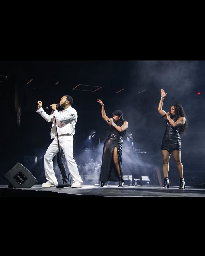 May be an image of dancing, microphone, concert and text