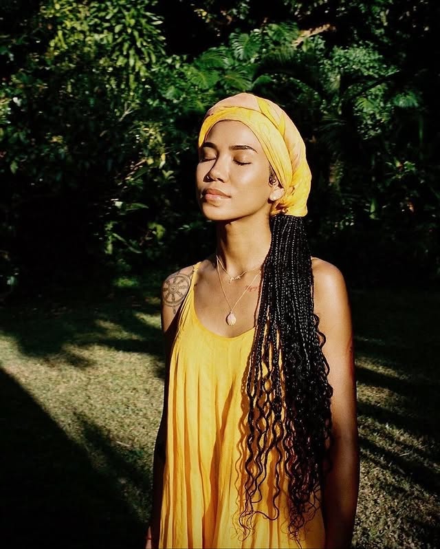 May be an image of one or more people, braids, headscarf, turban, headdress, sarong, head covering and text