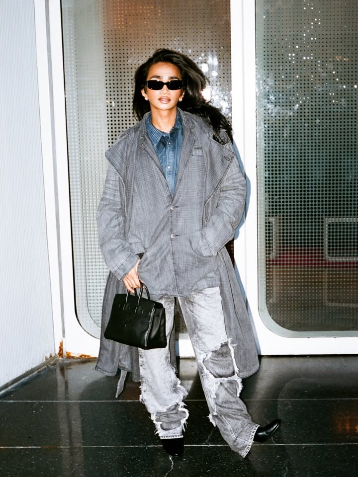 May be an image of overcoat, fur, parka, sweatsuit and text