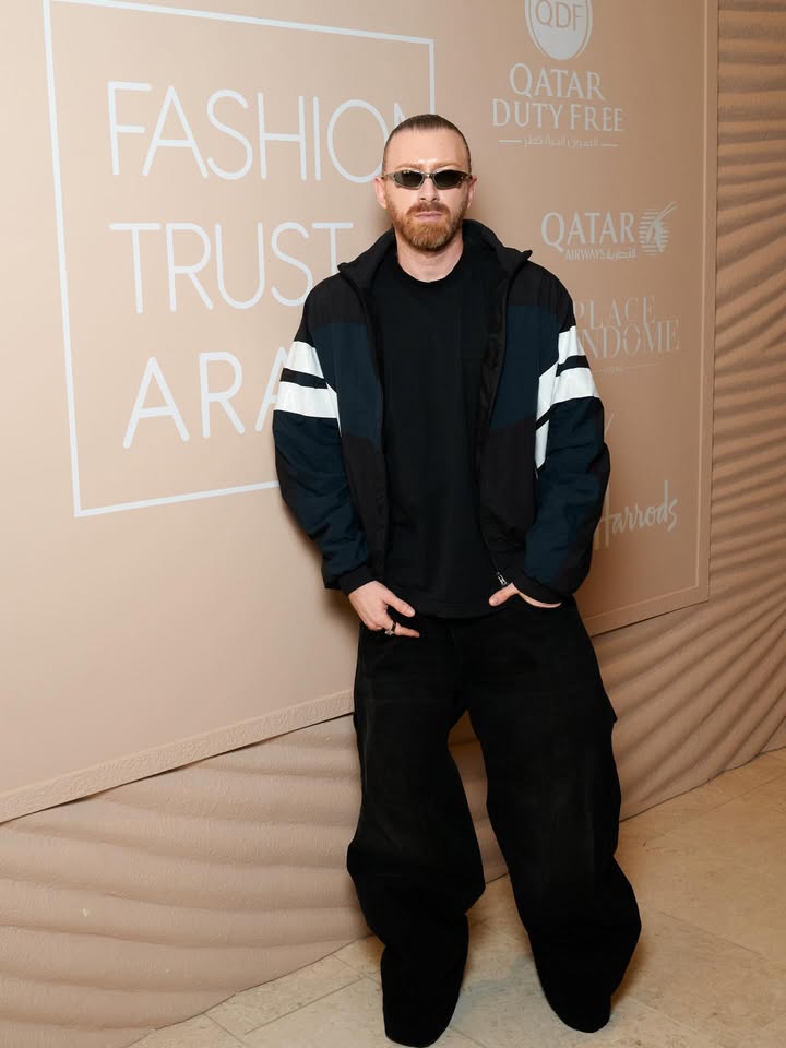 May be an image of eyewear, outerwear and text