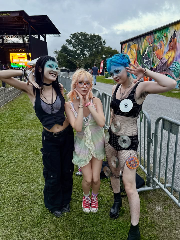 May be an image of glasses, fishnet stockings, headdress and text