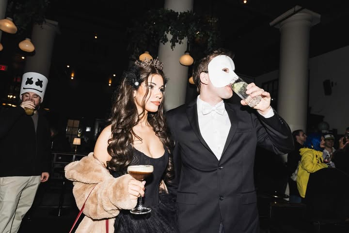 May be an image of champagne, dinner jacket, flask and wedding