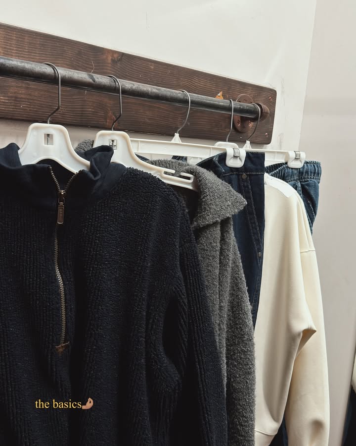 May be an image of duffle coat, overcoat, rack, fleece, coat rack and clothes hanger