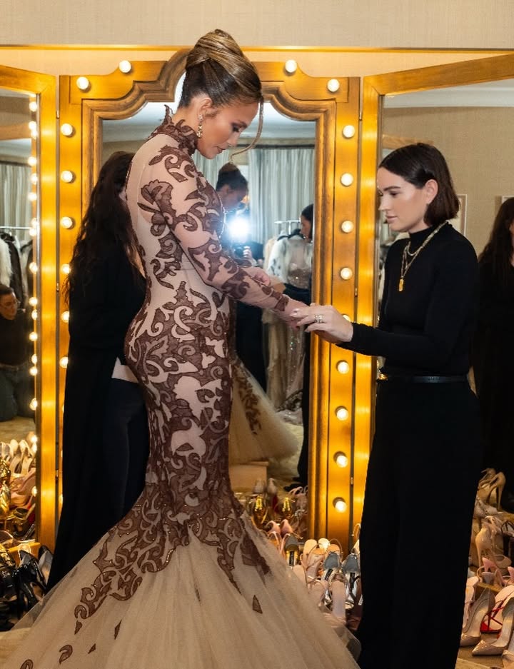 May be an image of gown, dress, wedding and text