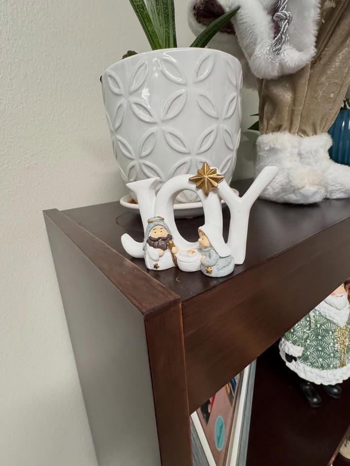 May be an image of elephant, towel rack, rack, house plant, shelf, office and text