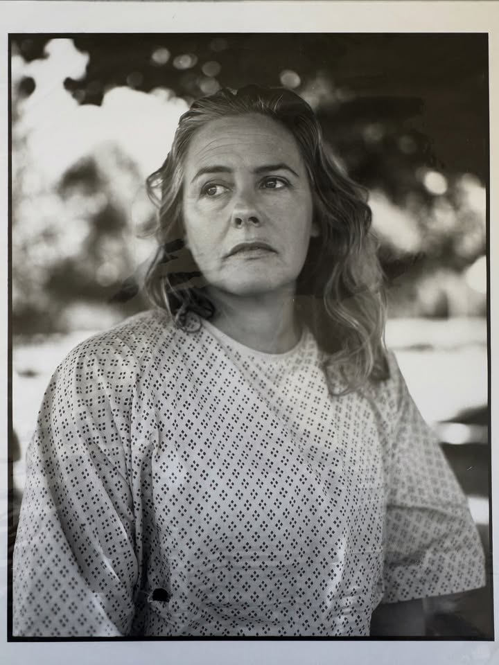 May be a black-and-white image of one or more people and text