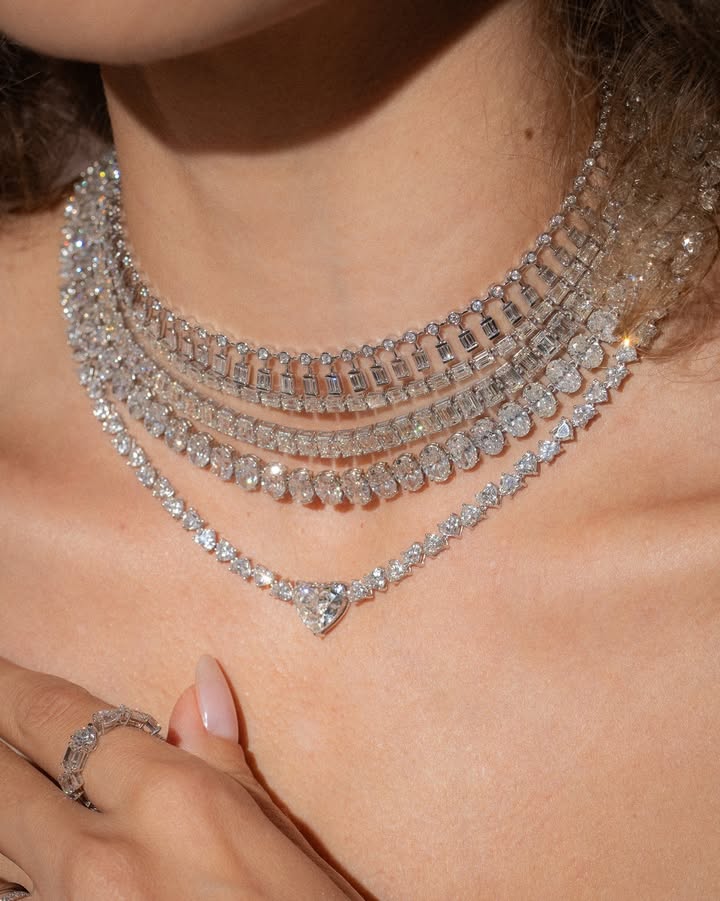 May be an image of necklace, choker and text