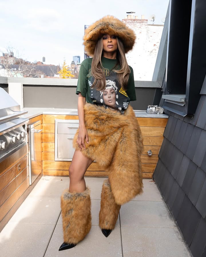 May be an image of fur coat, headdress, parka, miniskirt and text