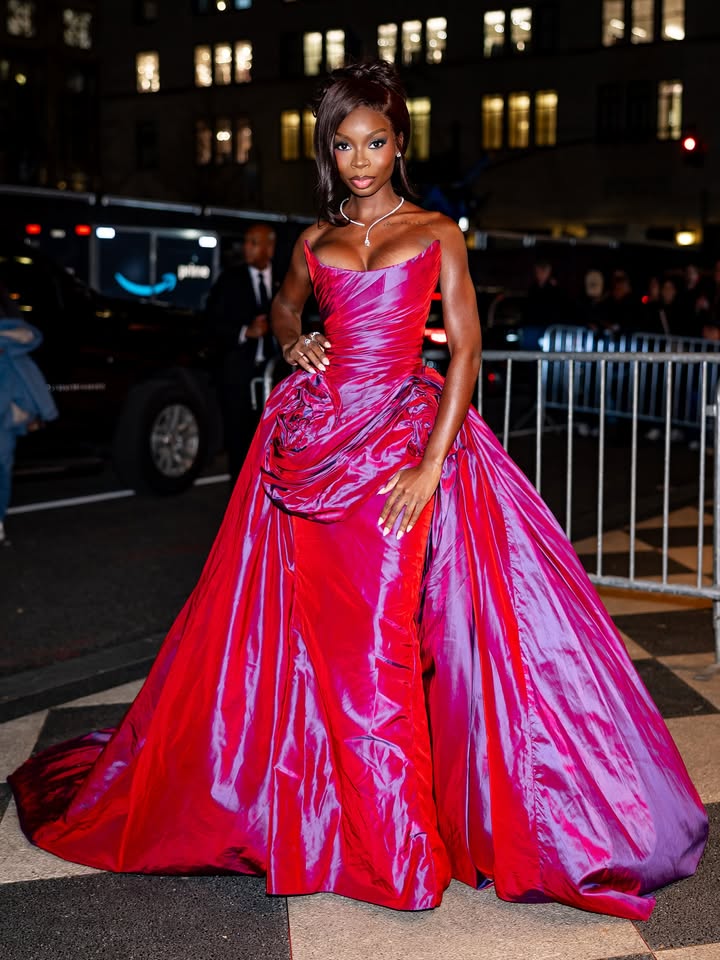 May be an image of gown, dress and text