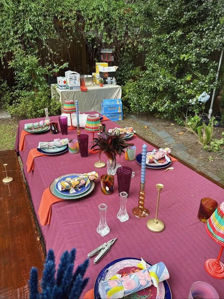 May be an image of table, candle holder, napkin ring, dining table, tablecloth, picnic and text