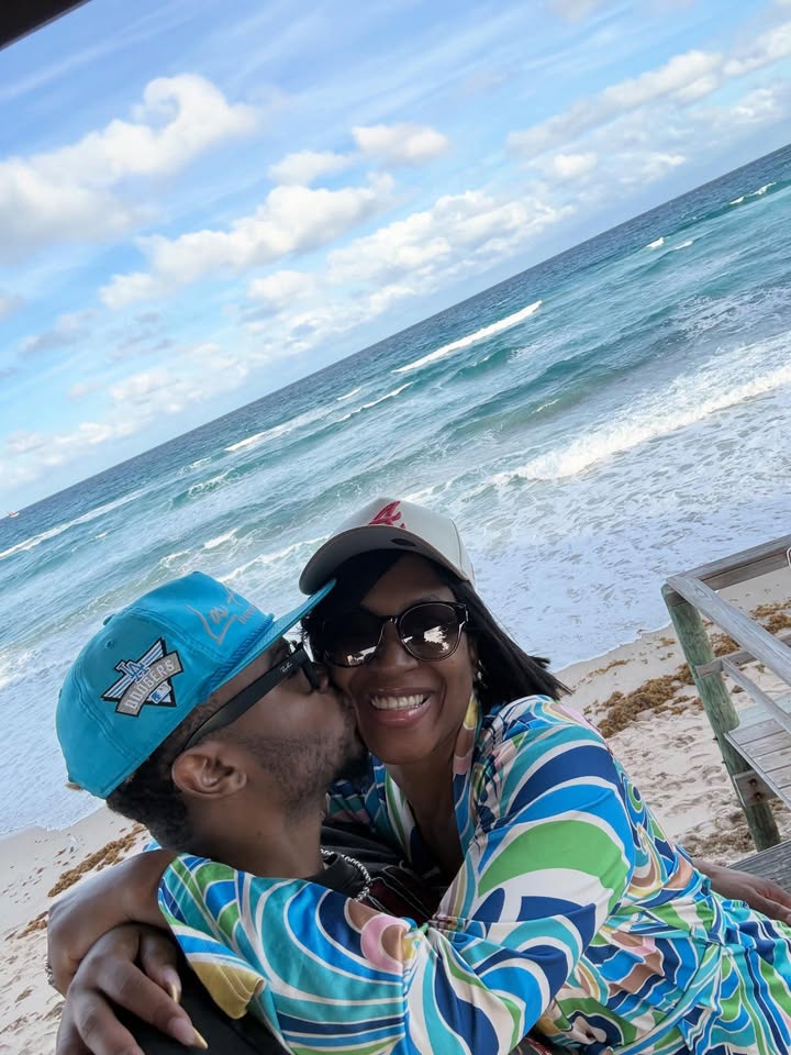 May be an image of one or more people, people kissing, ocean, beach and text