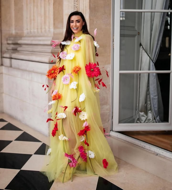 May be an image of dress and text