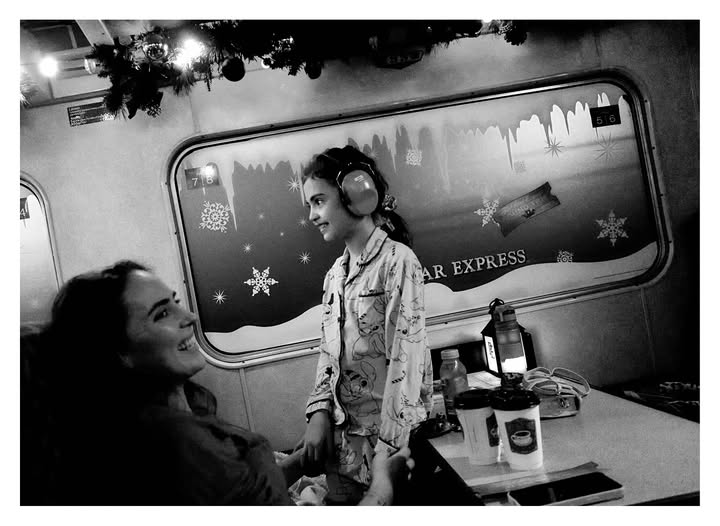 May be a black-and-white image of one or more people and text