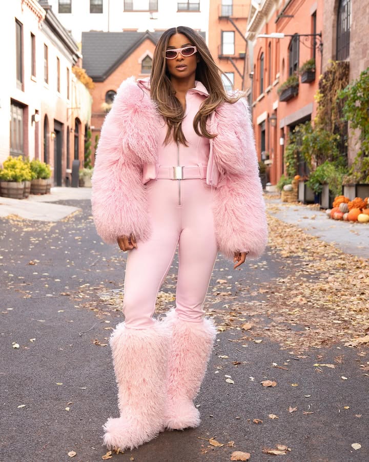 May be an image of fur coat, snowsuit, turtleneck and text