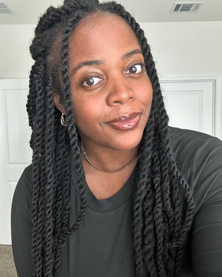 May be a selfie of one or more people, braids and text