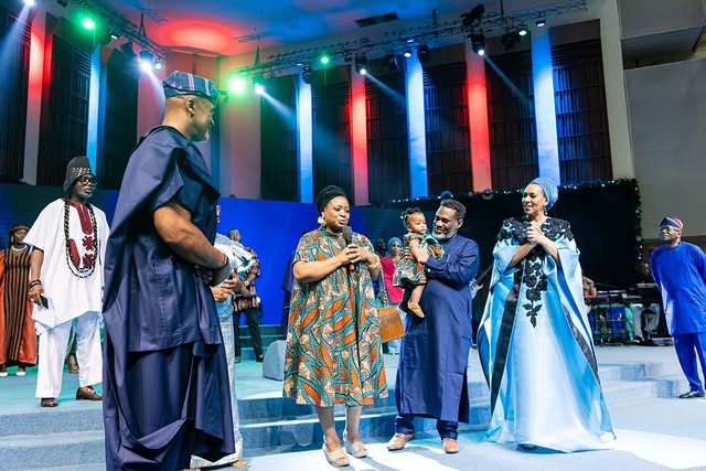 May be an image of one or more people, dais and text