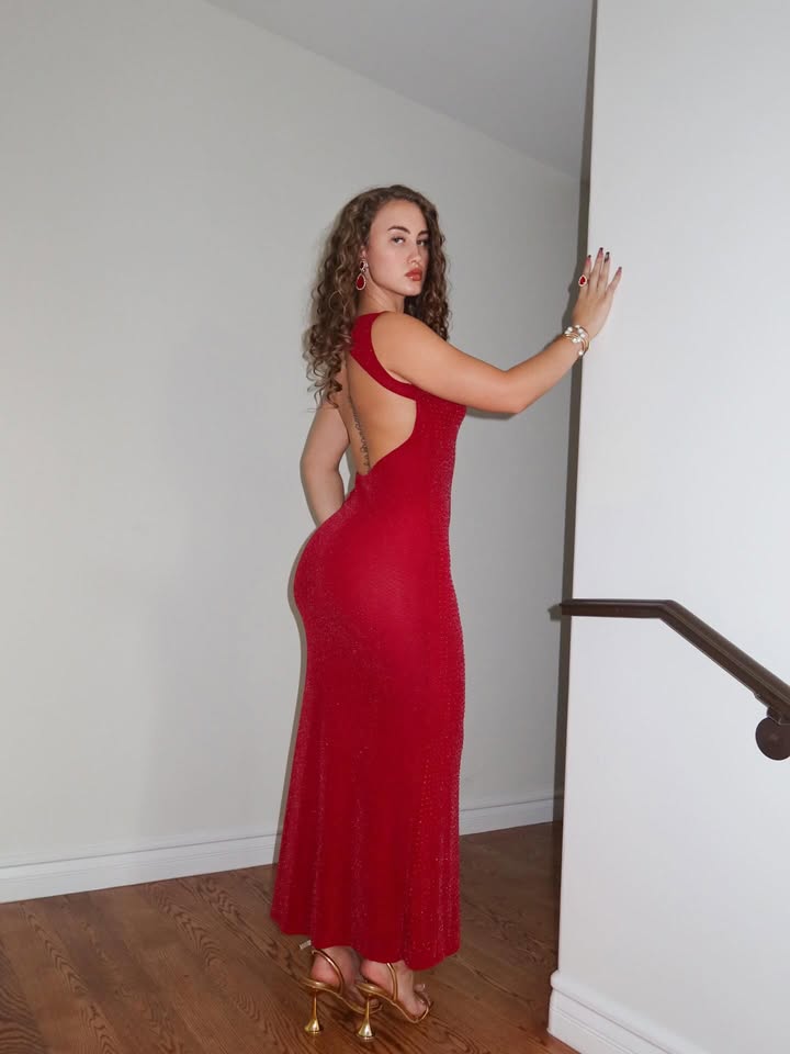 May be an image of gown, dress and text