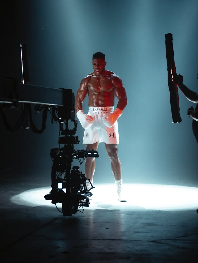 May be an image of one or more people, camera and text