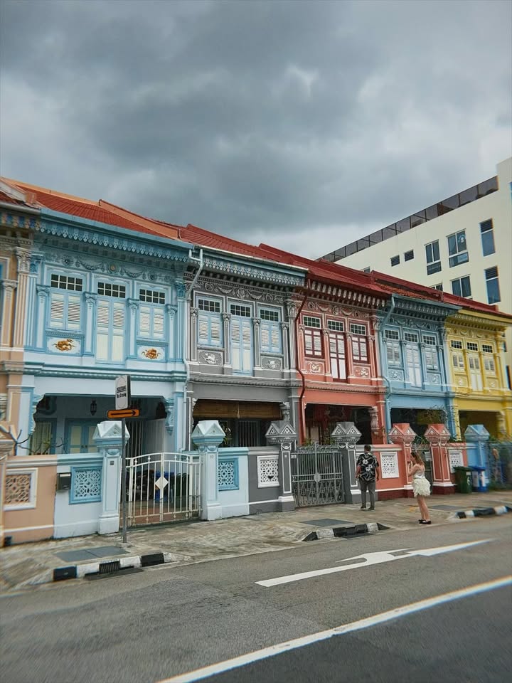 May be an image of street, buildings and text