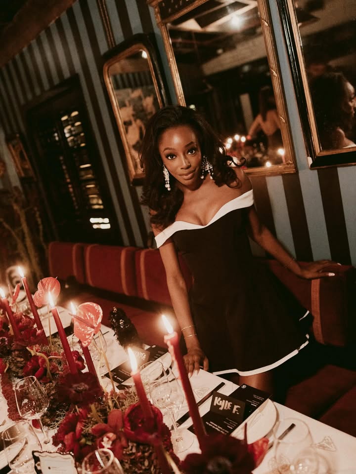 May be an image of one or more people, makeup, candle holder, candle, dress and text