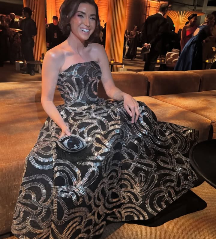 May be an image of gown, dress and text