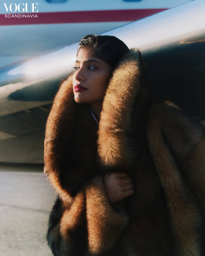 May be an image of one or more people, makeup, sable coat, magazine, parka, airplane and text that says 'VOGUE SCANDINAVIA'