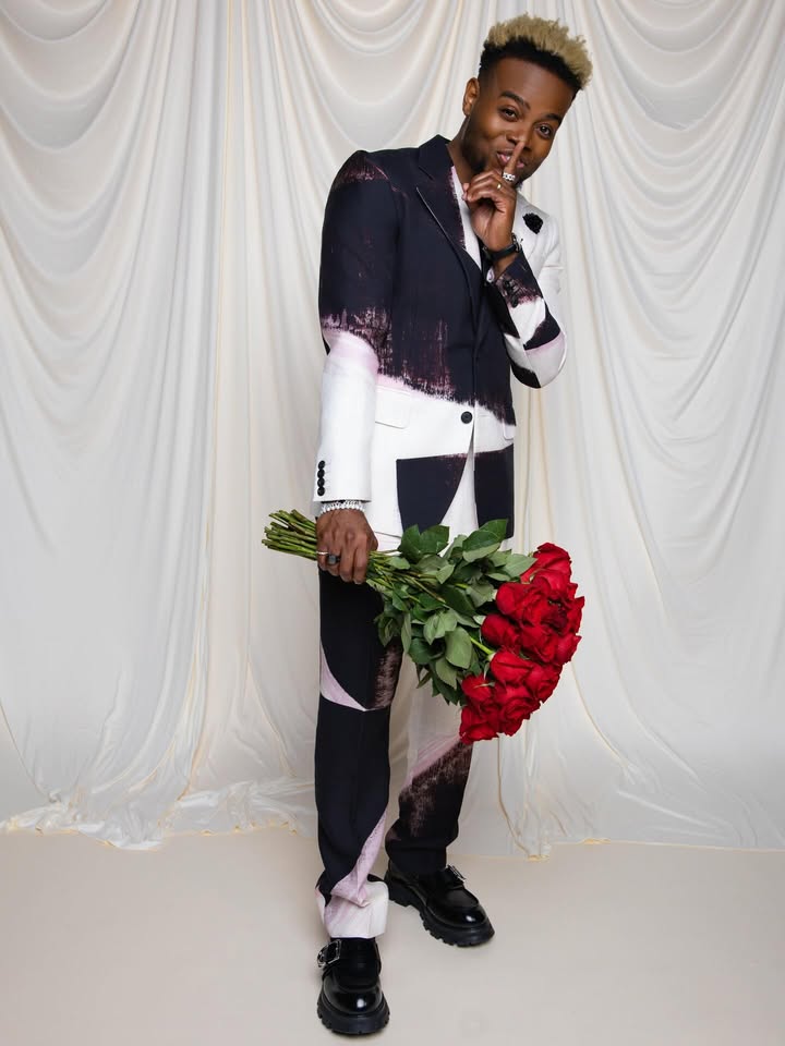 May be an image of one or more people, makeup, sweater, turtleneck, rose and text