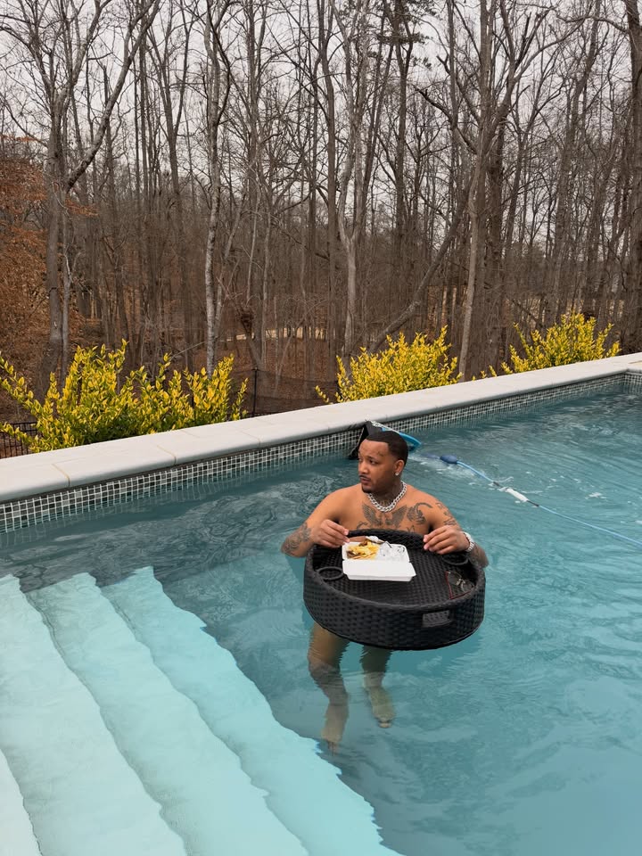 May be an image of swimming, raft, pool and text