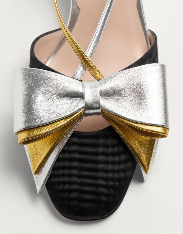 May be an image of leather, sandals, bow, slingback shoes and text