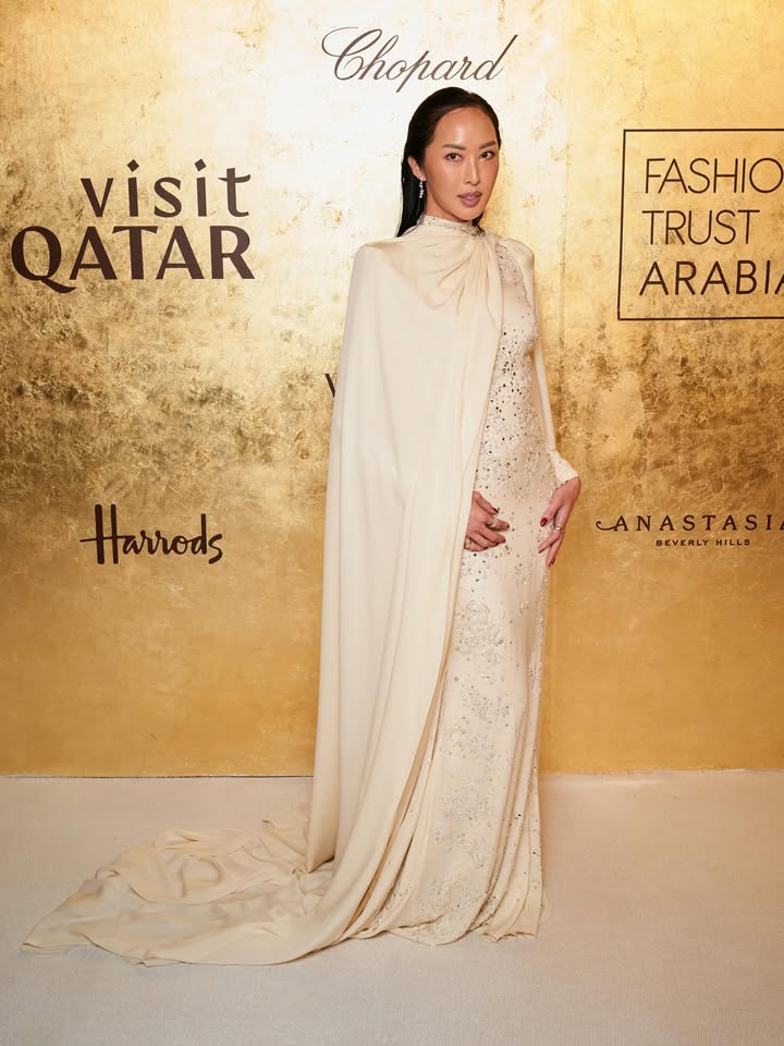 May be an image of gown, dress and text that says 'Chopard visit QATAR FASHIO TRUST ARABI Harrods LA ANASTASI STASI BEVERLY BEVERLYHILLS HILLS'