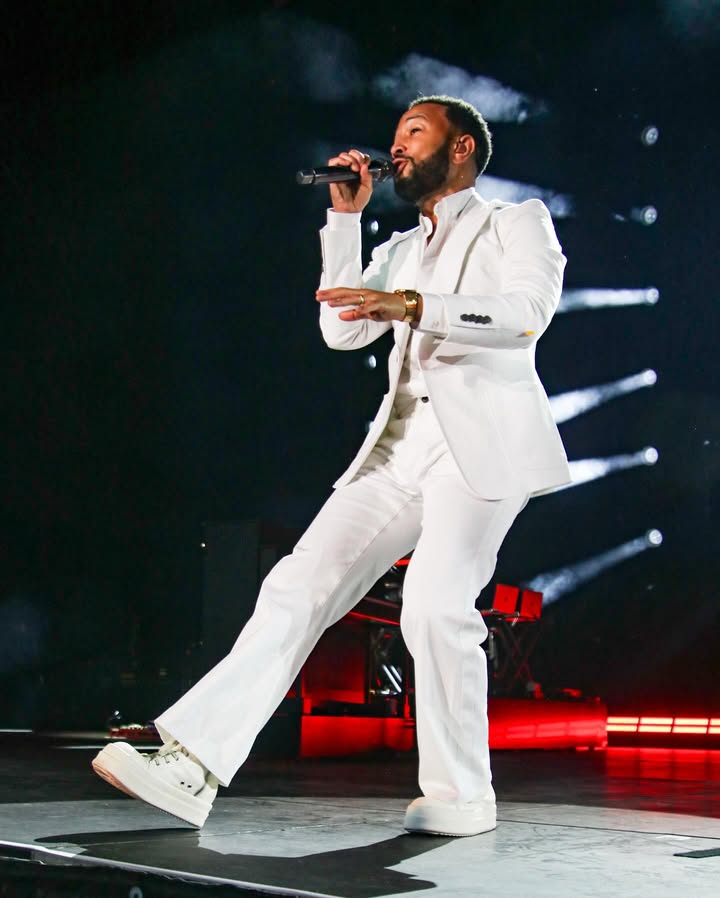 May be an image of blazer, microphone and concert